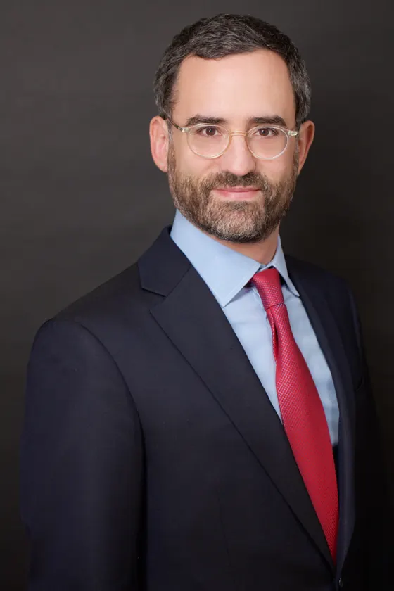 Corporate headshot with glasses and red tie, Times Square studio