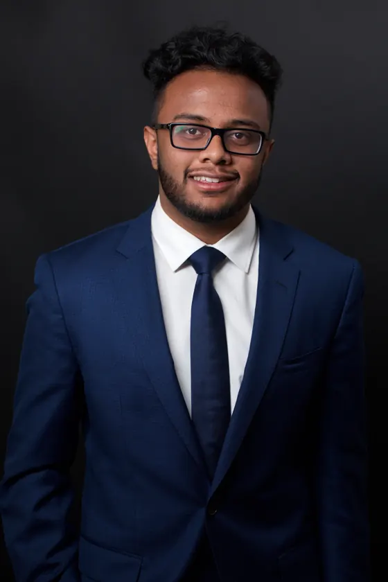 Business headshot of a man in glasses — iRolls studio standard