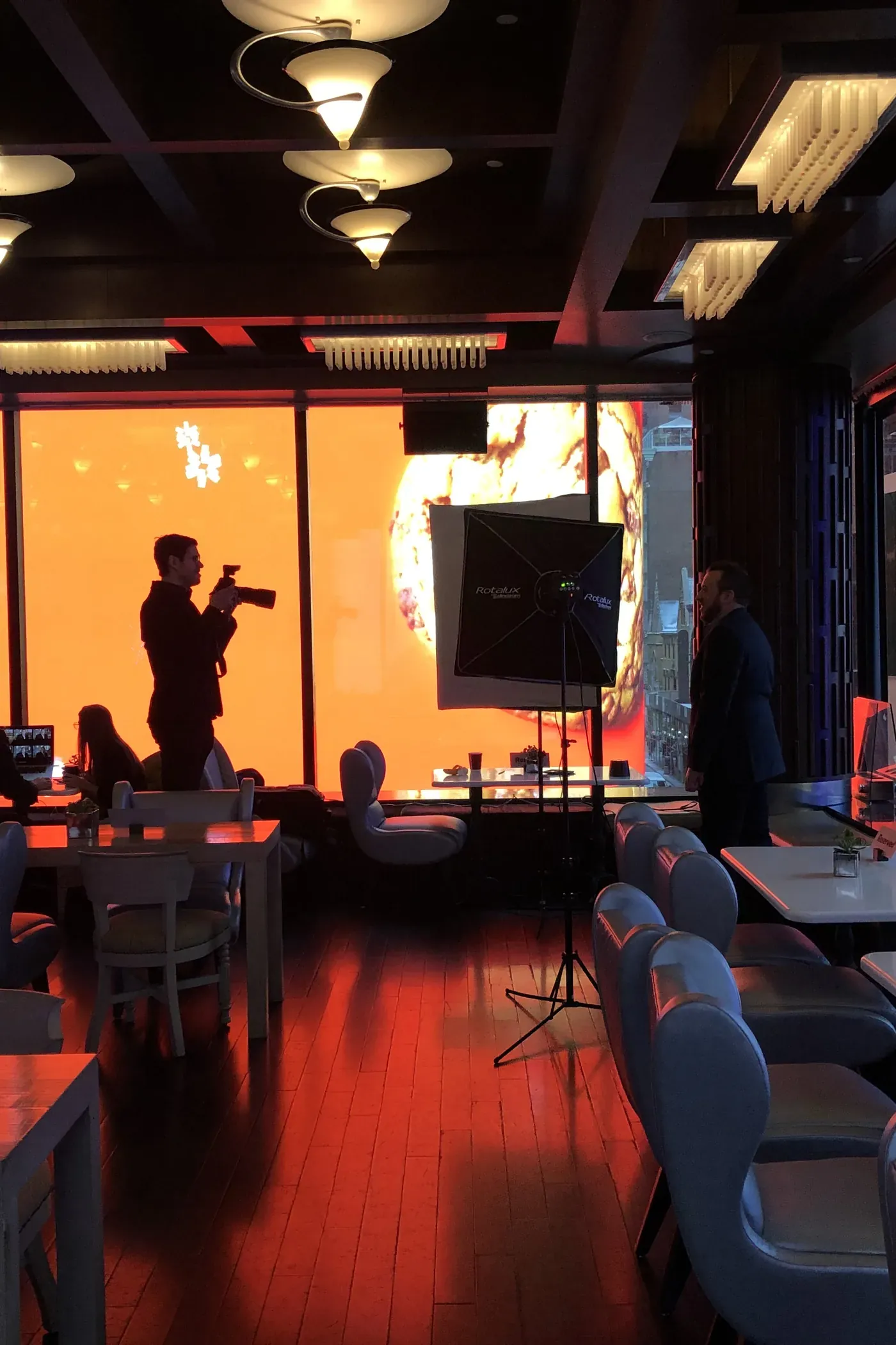 iRolls photographer running a Fast Flow headshot station at a Times Square event venue